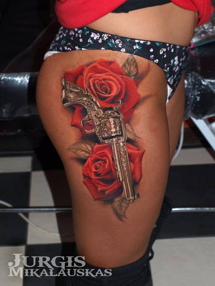 Rose Flowers And Revolver Tattoo On Side Hip