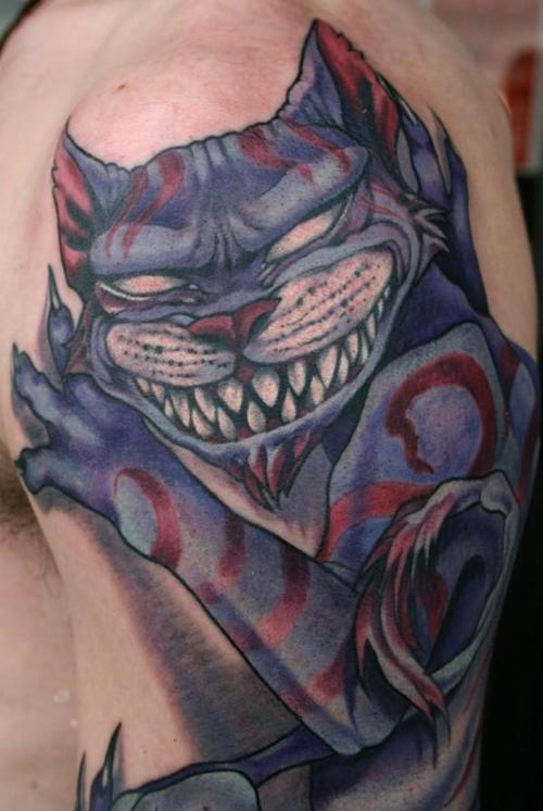 Scary Cheshire Cat Tattoo On Half Sleeve