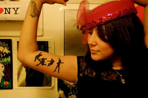 Silhouette Beatles Tattoo On Girl Right Bicep