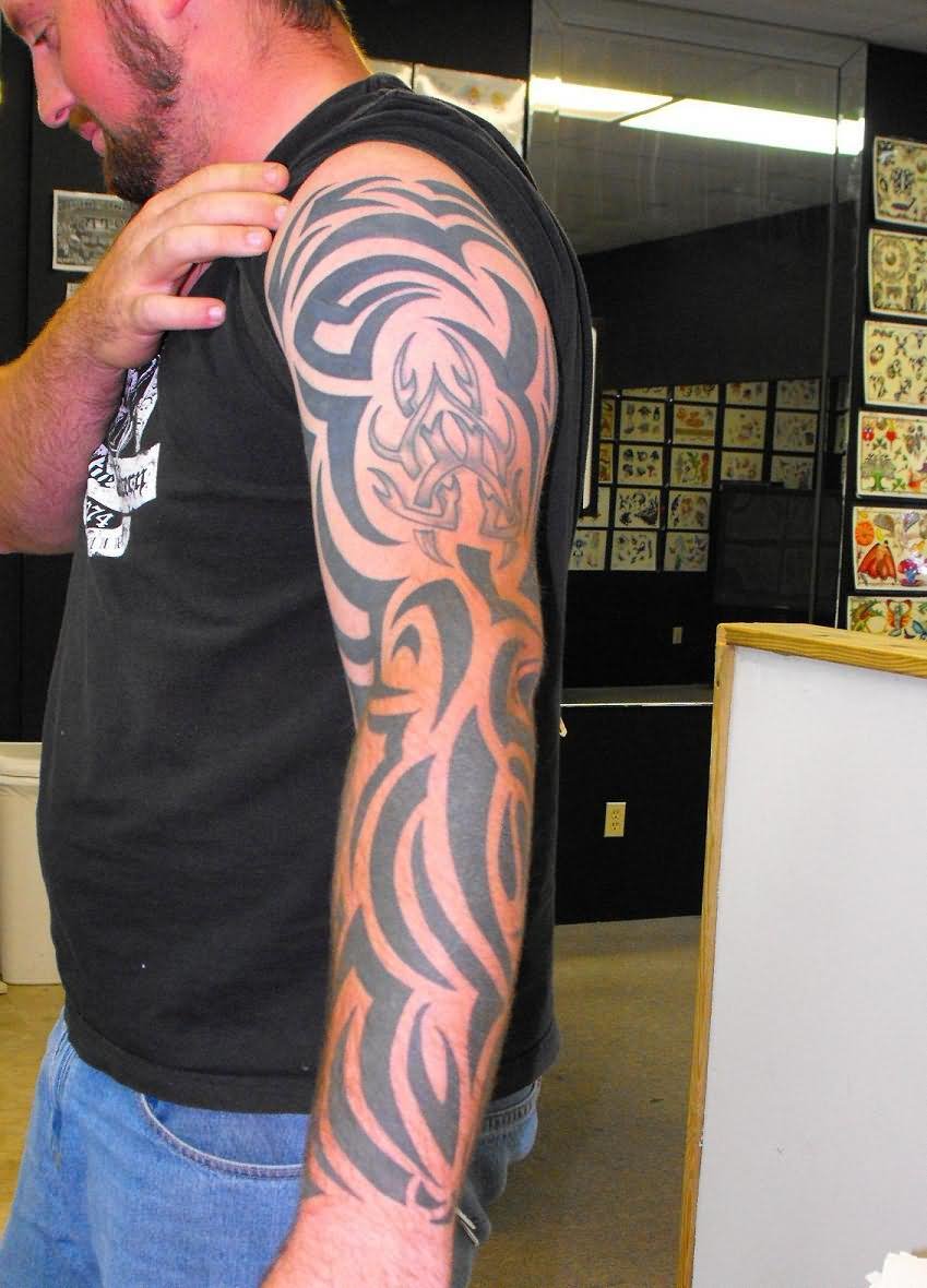 Simple Black Tribal Design Tattoo On Man Left Full Sleeve