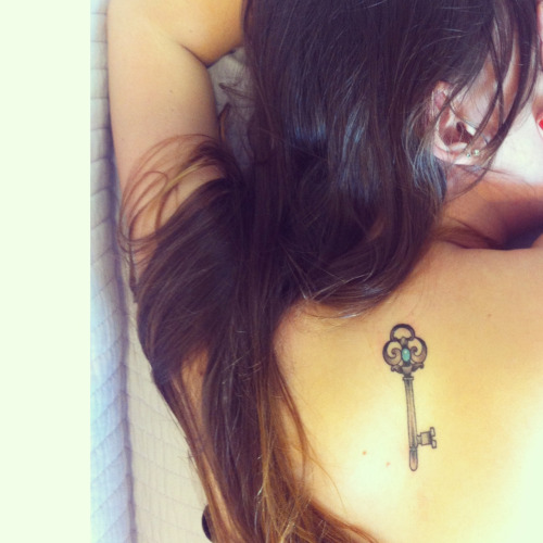 Skeleton Key Tattoo On Girl Upper Back