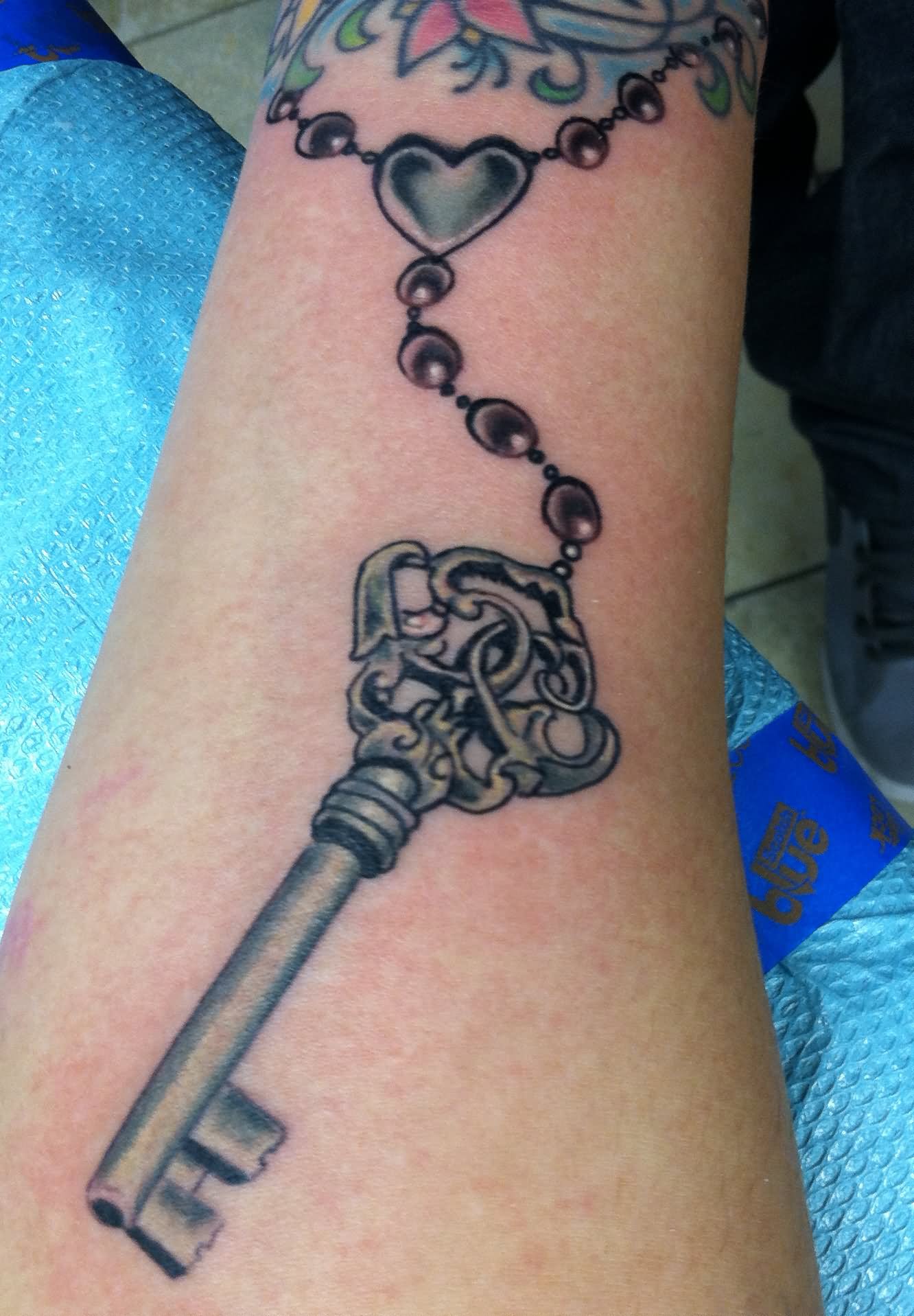 Skeleton Key With Chain Tattoo On Arm