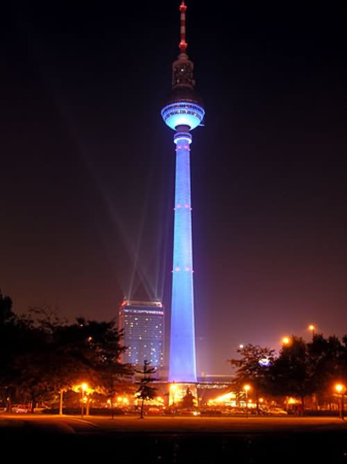 The Fernsehturm Tower Lit Up At Night In Berlin