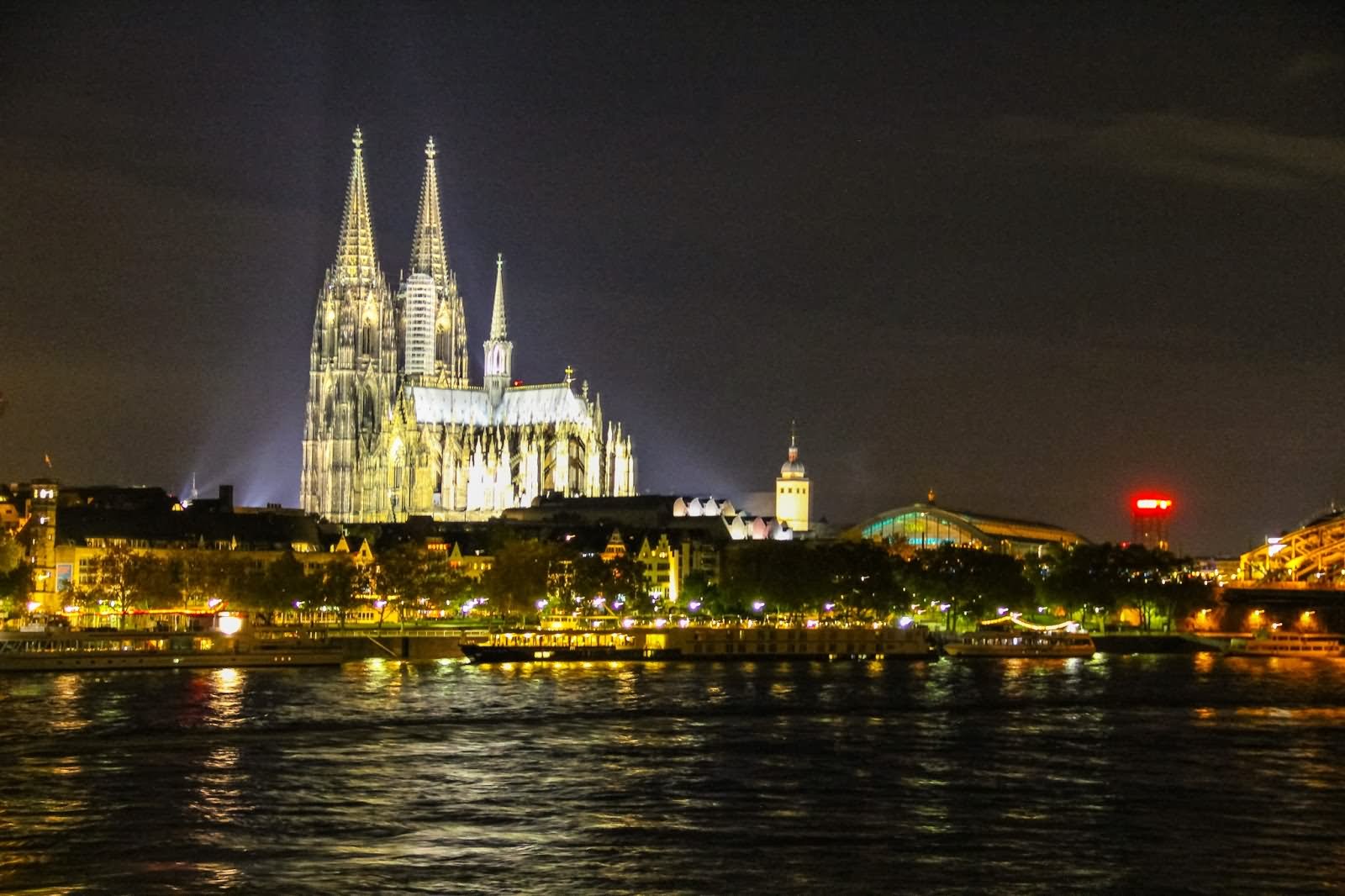 The Night Shot Of The Cologne Cathedral Across The Rhine River In Cologne