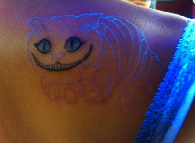 Uv Rays Cheshire Cat Tattoo On Back Shoulder