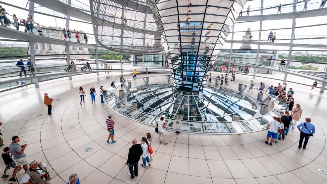 Visitors Walking Around The Dome Of The Reichstag Building In Berlin