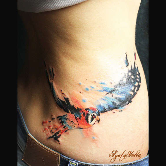 Watercolor Abstract Flying Bird Tattoo On Lower Back