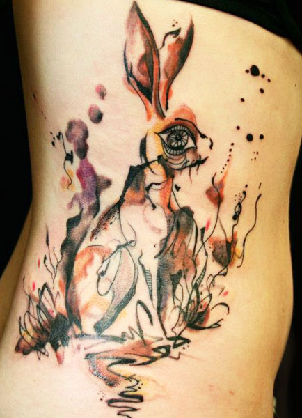 Watercolor Abstract Rabbit Tattoo On Girl Side Rib
