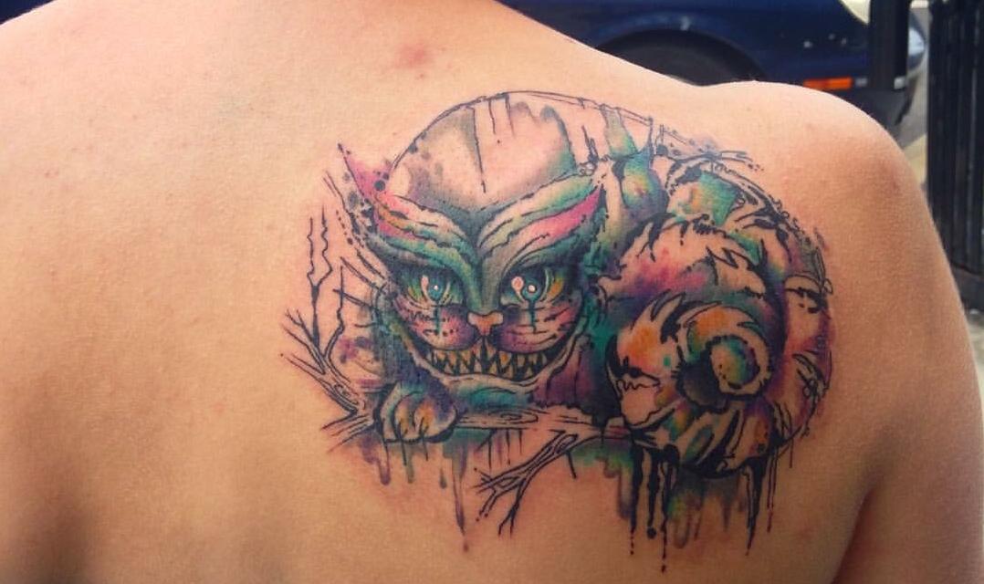 Watercolor Cheshire Cat Tattoo On Back Shoulder