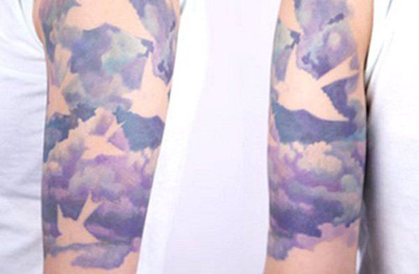 Watercolor Clouds Tattoo On Half Sleeve