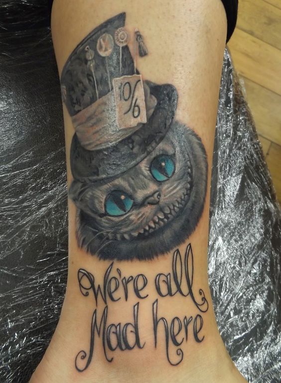 We’re All Mad Here Cheshire Cat Tattoo On Leg