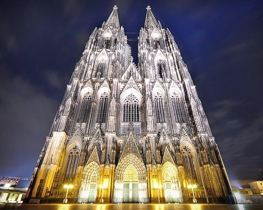 West Front Facade Of The Cologne Cathedral Lit Up At Night