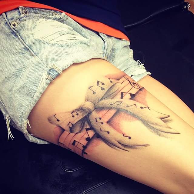 Amazing Music Notes Garter Tattoo On Right Thigh