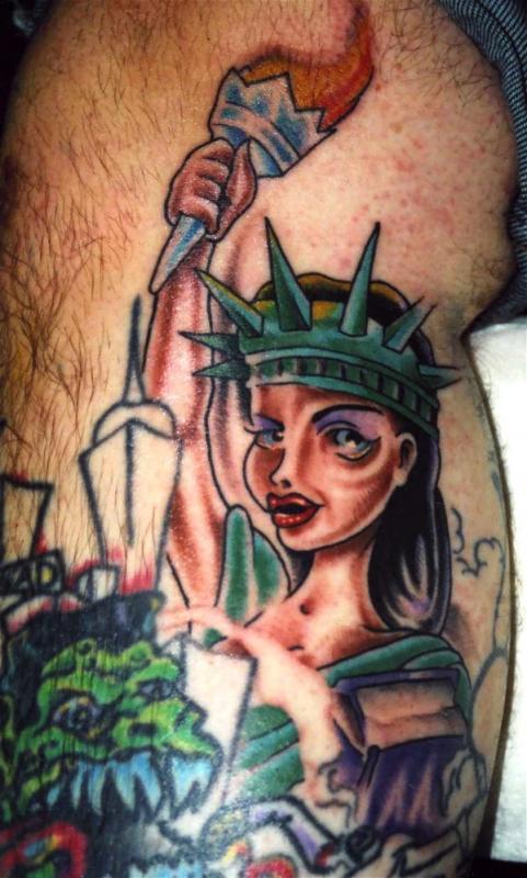 Attractive Traditional Statue Of Liberty Girl Tattoo Design
