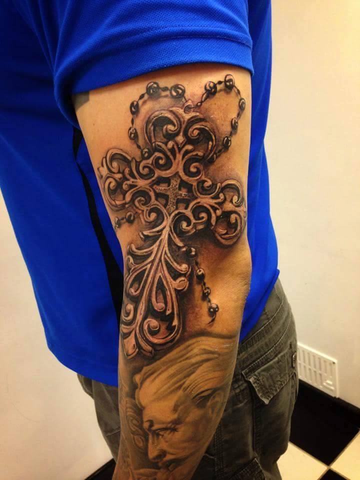 Beautiful Rosary Cross Tattoo On Left Arm by Nipper Williams