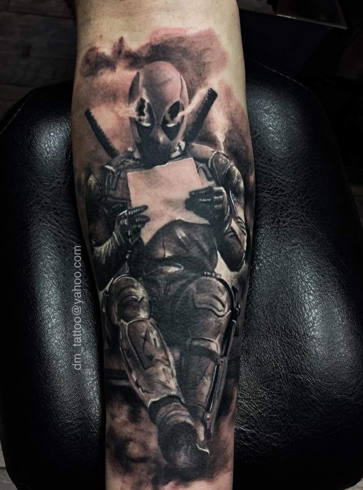 Black And Grey Deadpool Tattoo On Arm Sleeve