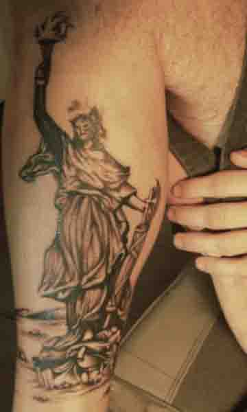 Black And Grey Statue Of Liberty Tattoo On Leg Calf