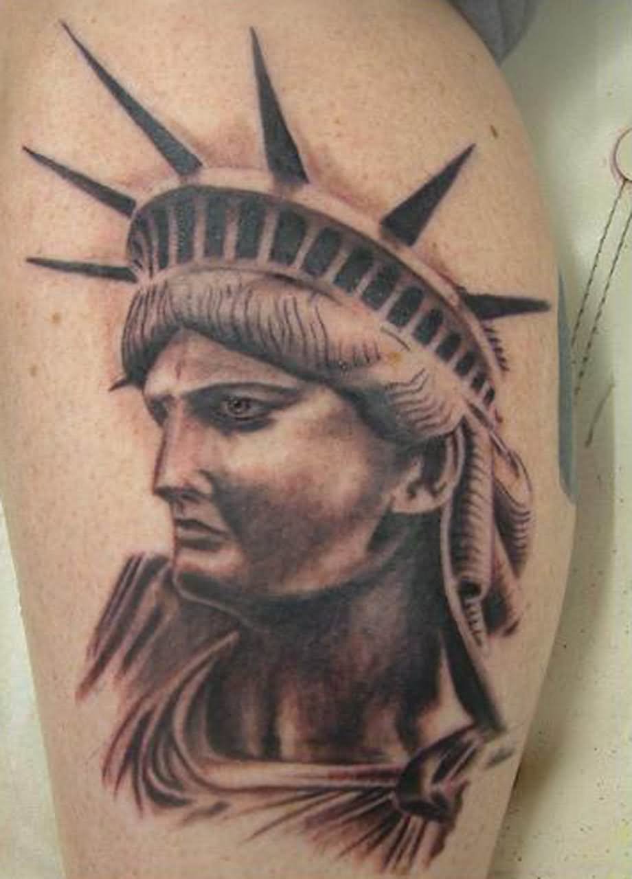 Black Ink Statue Of Liberty Face Tattoo Design For Leg Calf