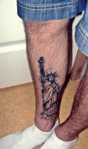 Black Statue Of Liberty Tattoo On Right Leg