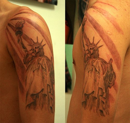 Cool Statue Of Liberty Tattoo On Left Half Sleeve