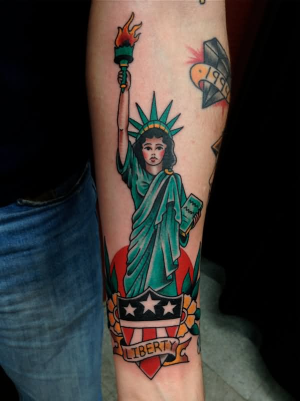 Cute Traditional Statue Of Liberty With Shield And Banner Tattoo On Forearm