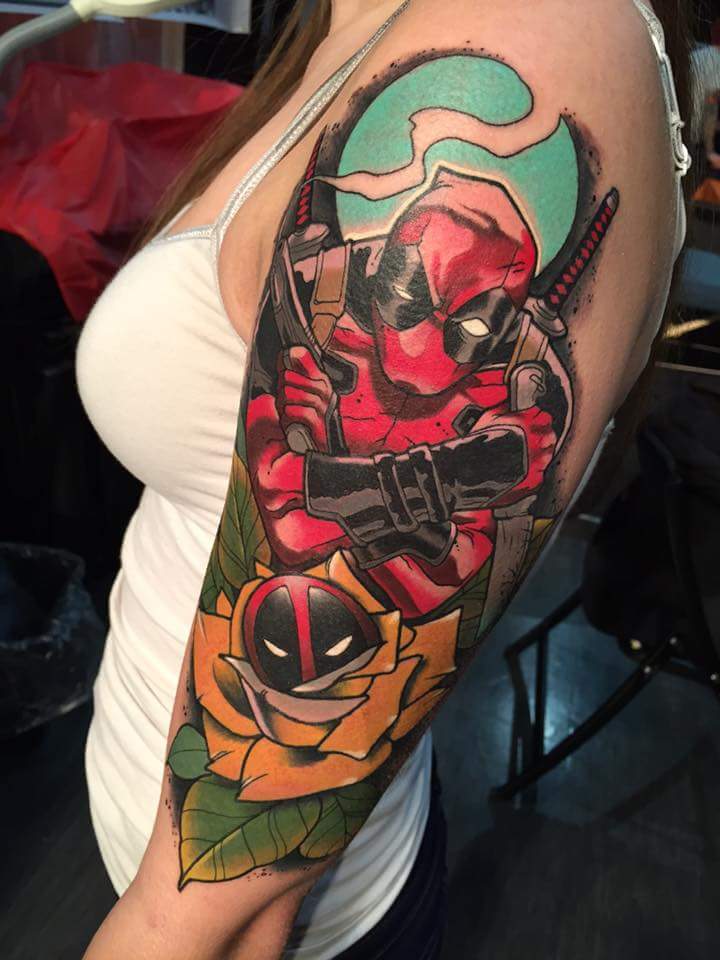 Deadpool With Gun Tattoo On Left Half Sleeve
