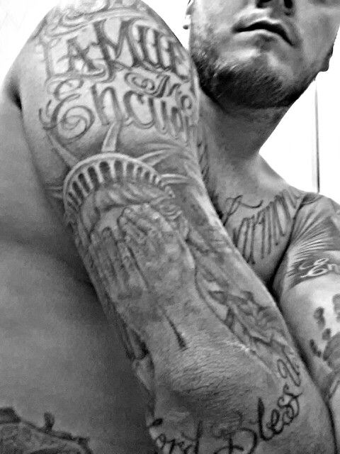 Grey Ink Crying Statue Of Liberty Tattoo On Man Right Half Sleeve