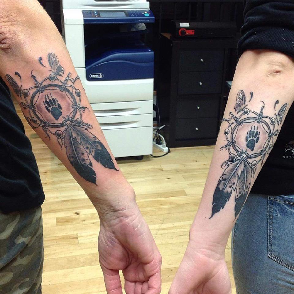 Grey Ink Wolf Paw In Dreamcatcher Tattoo For Arm