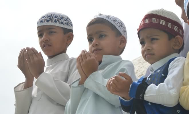 Muslim Kids Offering Prayers To Celebrate Eid Ul-Fitr