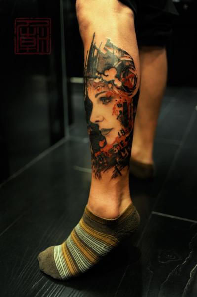 Abstract Girl Face Tattoo On Left Leg Calf