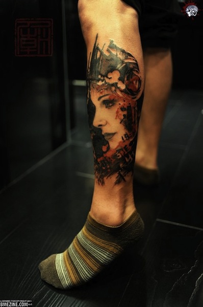 Abstract Girl Face Tattoo On Left Leg Calf
