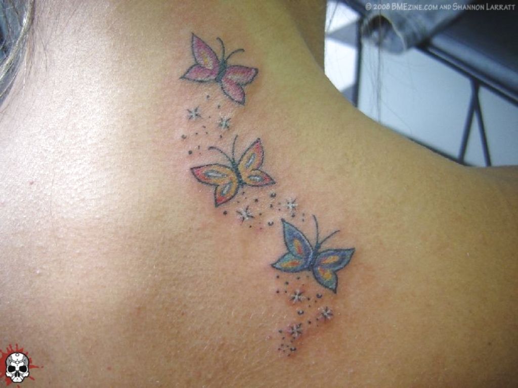 Attractive Butterflies Tattoo On Back Neck