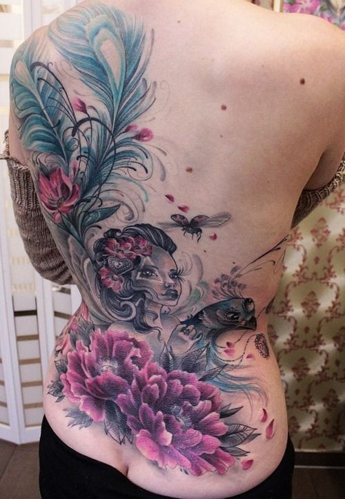 Awesome Girl Face With Flowers And Feathers Tattoo On Women Full Back