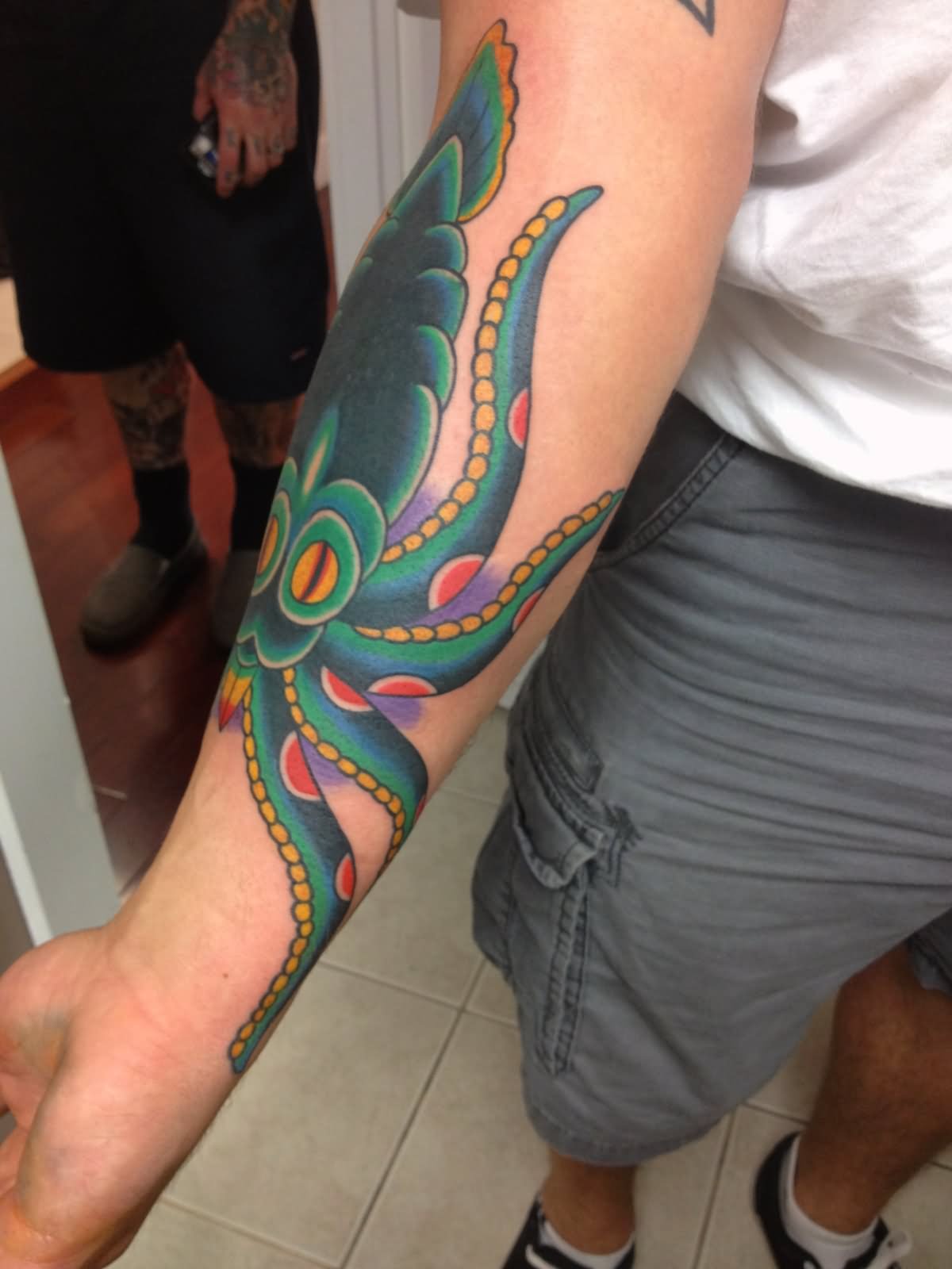 Black And Green Ink Squid Tattoo On Right Arm