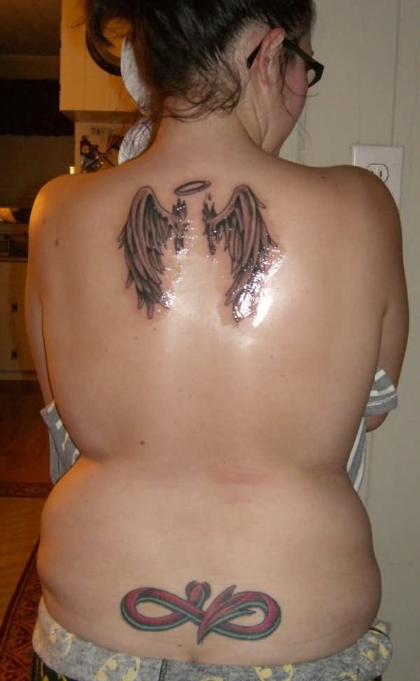 Black And Grey Angel Wings Tattoo On Upper Back