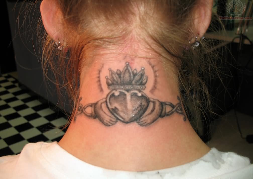 Black And Grey Claddagh Tattoo On Girl Back Neck