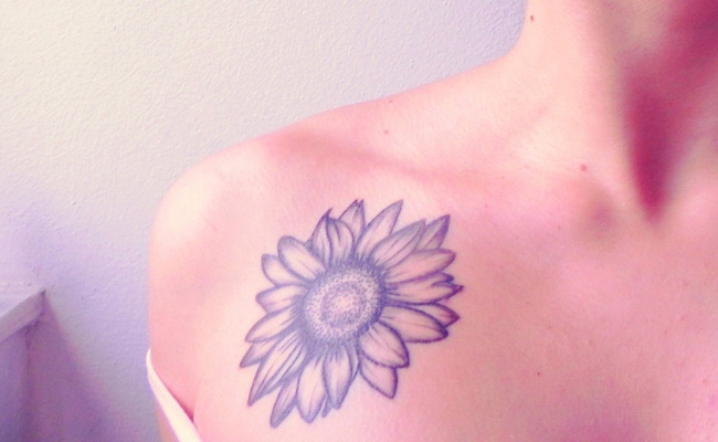 Black And Grey Dahlia Flower Tattoo On Right Front Shoulder