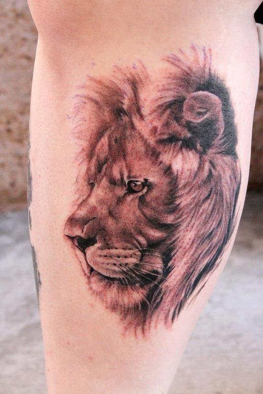 Black And Grey Lion Head Tattoo Design For Side Leg Calf By Jeff Norton