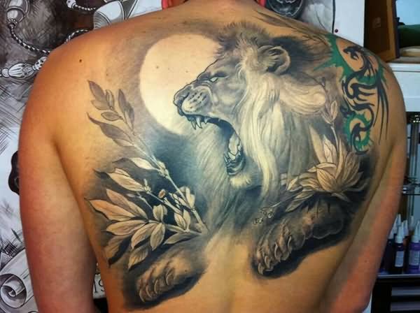 Black And Grey Roaring Lion Head Tattoo On Upper Back