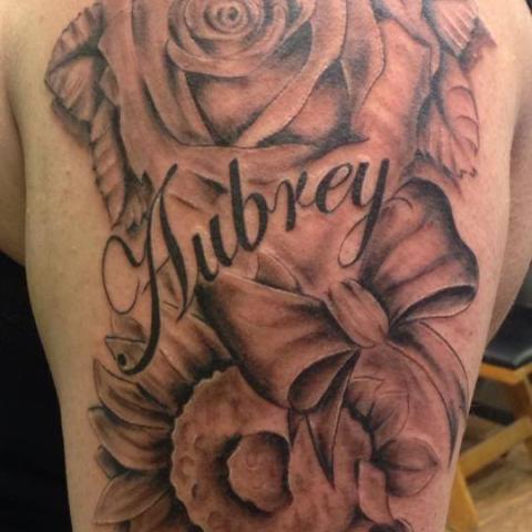 Black And Grey Rose With Bow And Aubrey Name Tattoo Design For Shoulder