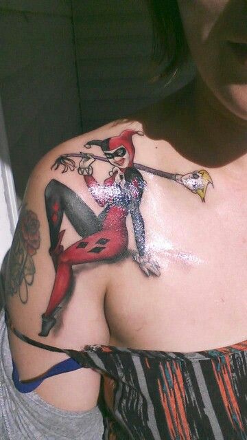 Black And Red Harley Quinn Tattoo On Front Shoulder