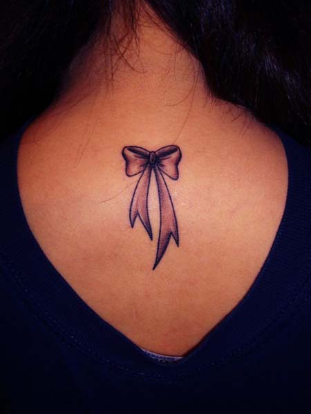 Black Ink Bow Tattoo On Women Upper Back