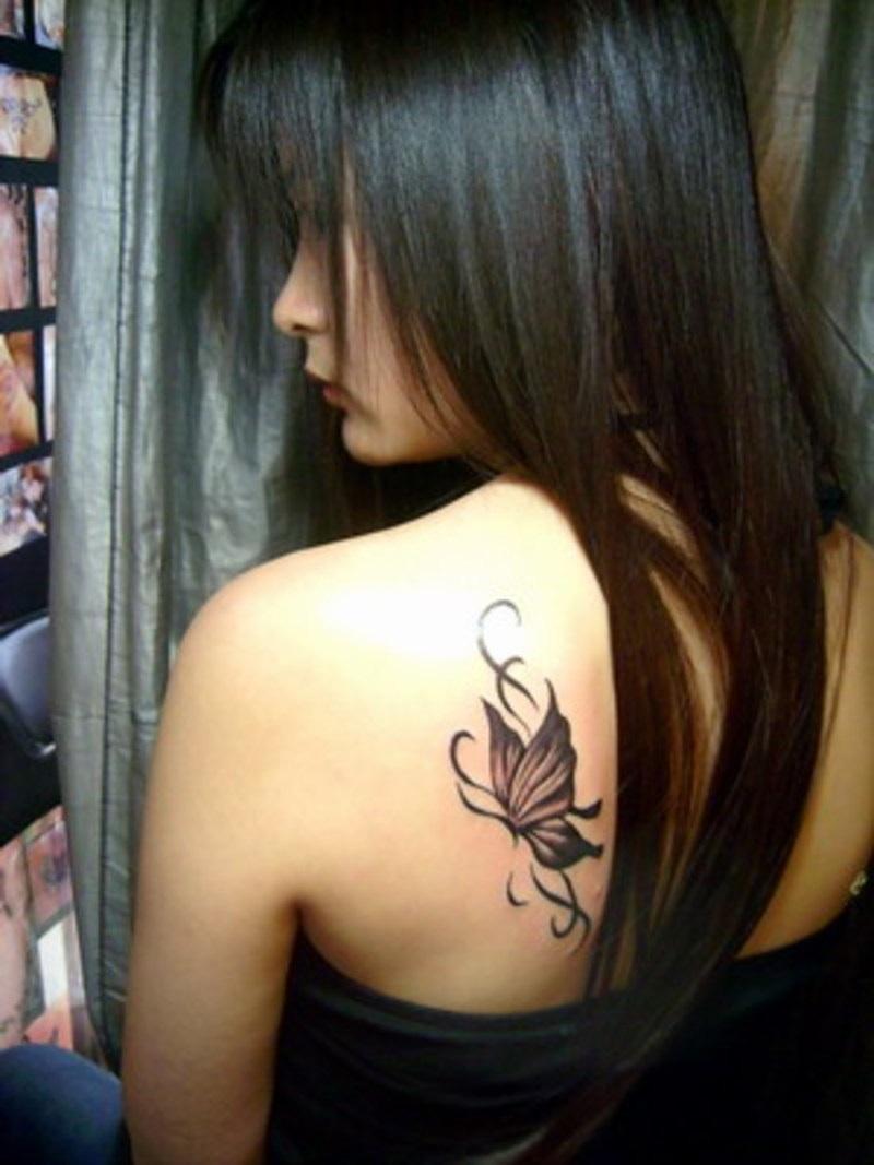 Black Ink Butterfly Tattoo On Women Left Back Shoulder