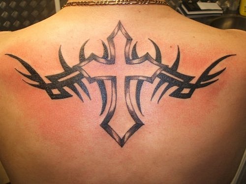 Black Ink Cross With Tribal Design Tattoo On Man Upper Back