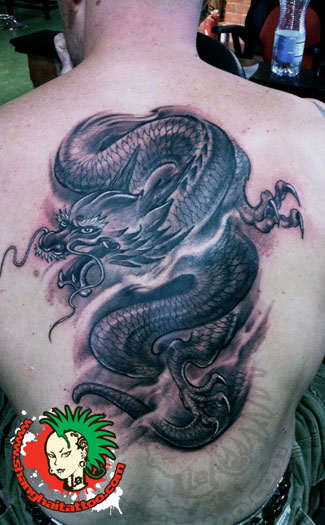Black Ink Dragon Tattoo On Man Back