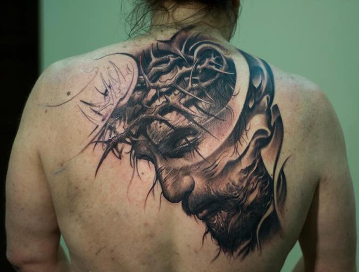 Black Ink Jesus Face Tattoo On Upper Back