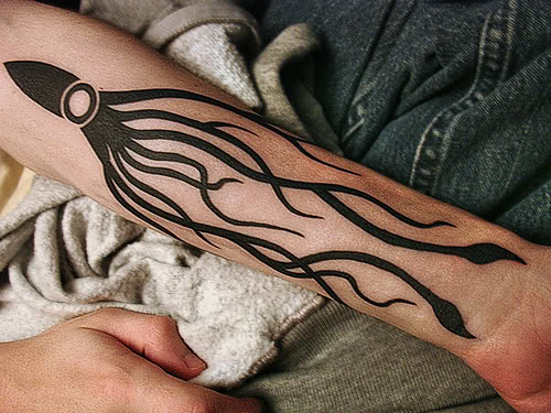 Black Ink Squid Tattoo On Left Forearm