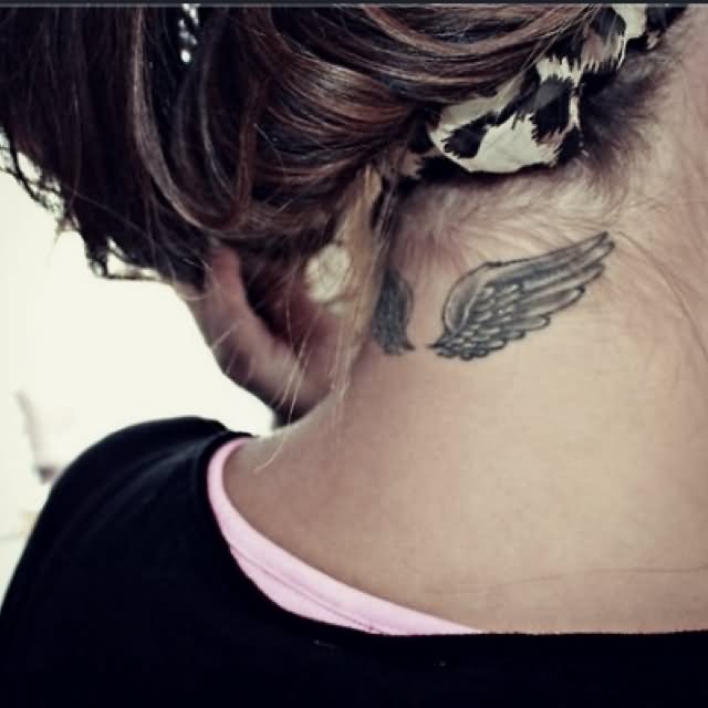 Black Ink Wings Tattoo On Girl Back Neck