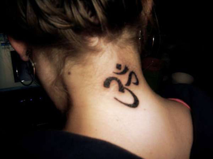 Black Om Tattoo On Girl Back Neck