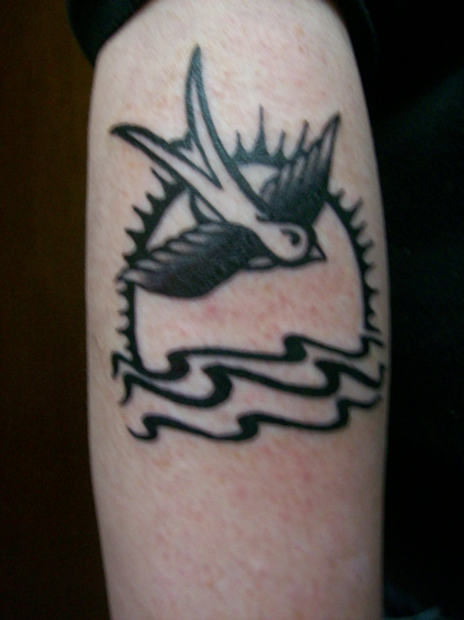 Black Outline Above The Sea Sparrow Tattoo On Arm